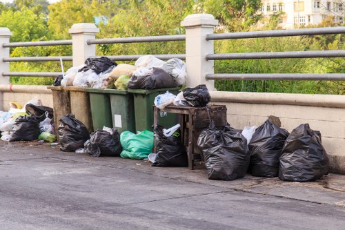 Man and van preparing to load bulky waste on a city street
