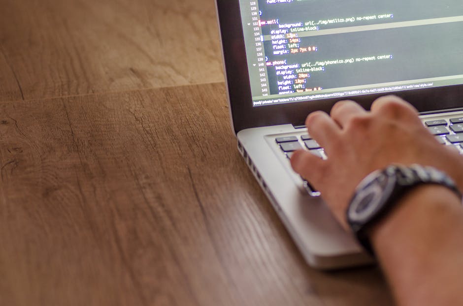 The image displays a computer screen with a dark background featuring lines of code highlighted in various colors, including blue, green, yellow, and purple. The code appears to be CSS or similar styl